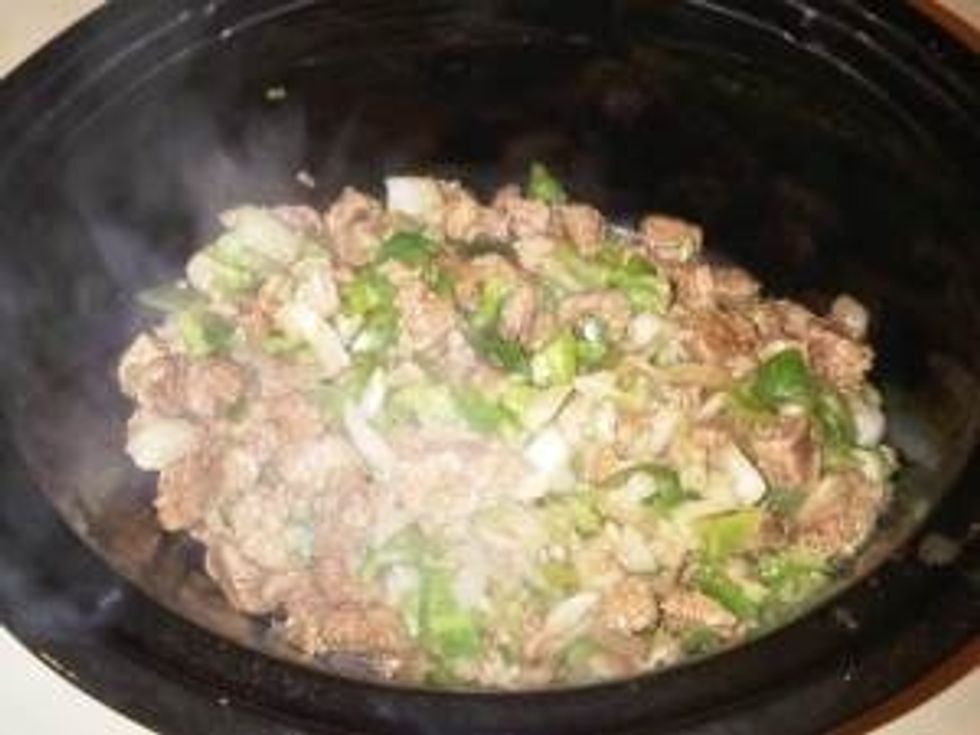 Before placing meat mix into the crockpot drain it in a drainer to remove any fat that was produced from cooking it.  After you have done this place the meat mix into the crockpot and stir it.