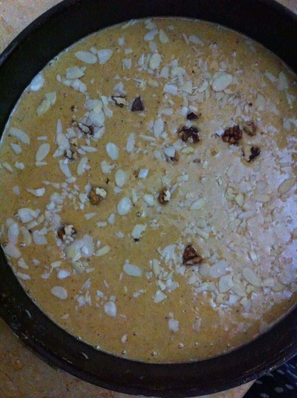 Before popping in oven, Sprinkle any nuts, shaved or whole, choc chips or prunes. Or all of em to make the cake more chunky n fruity