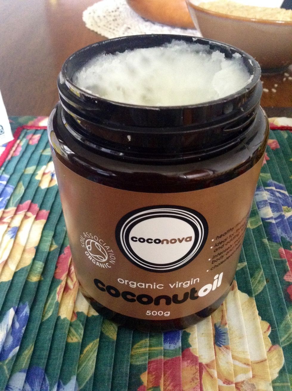 Before pouring water in the cup, take a teaspoon, or more to begin, of coconut oil, still solid. Put the tea bag in the cup with the coconut oil and pour water over them, so they infuse together.