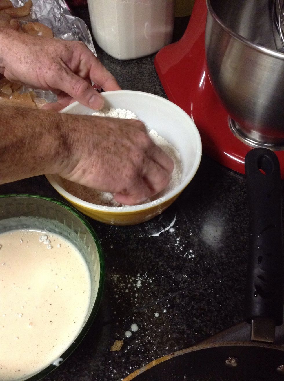 Before putting the chicken into the pan,and after dipping them in batter pat them off,before putting them in the flour.