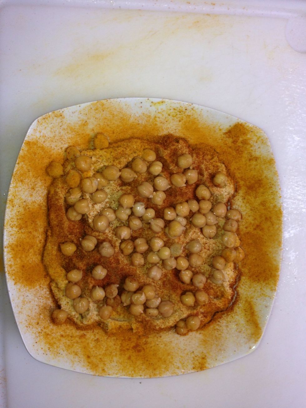 Before serving, take out the garlic, transfer to the serving dish.  Garnish with the pealed  beans .  Usefull tip:   spray the plate with olive oil so it will not make a dry crust while at the table