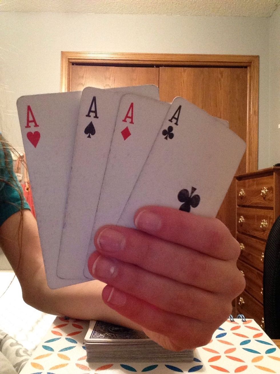 Before starting the trick (and with no one watching) remove the four aces from the deck.
