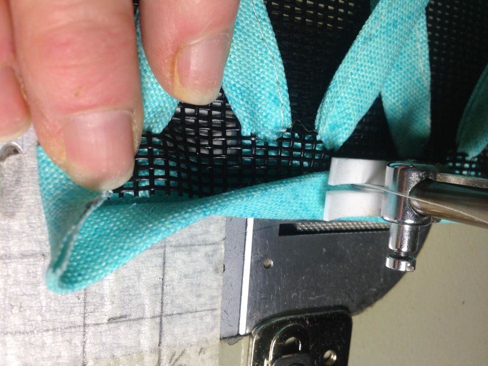 Before stitching all the way to the end \u2013 fold the other raw edge of the band over, then fold the band down as shown.