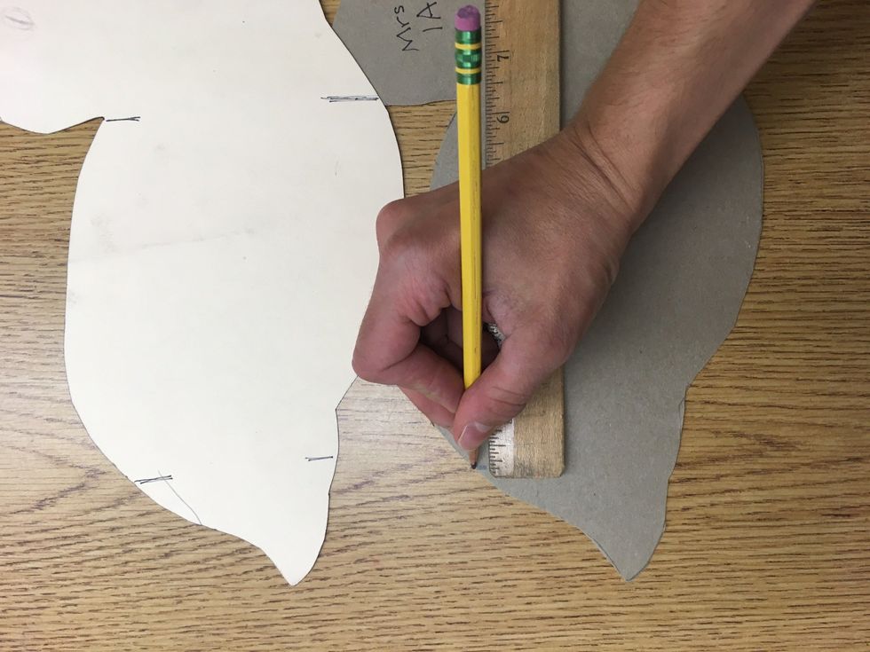 Before the tail, mark a line at the zero on the ruler on the back of the duck. Then before the head, mark an ending line. It should end on an inch or half inch. This duck ends at 6 inches.