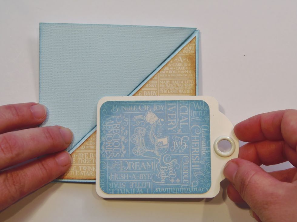 Before you begin to embellish the card plan how you want to layer your images. You'll only be gluing them to ONE of the triangles. You can overlap them, but don't glue them to the opposite triangle.