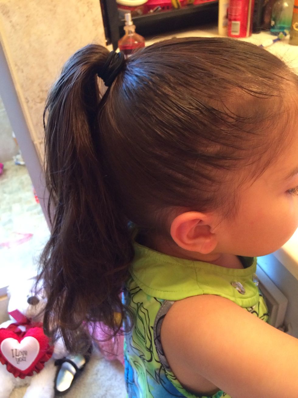 Before you do the first step untangle your hair and spray water on it then put it into a pony tail