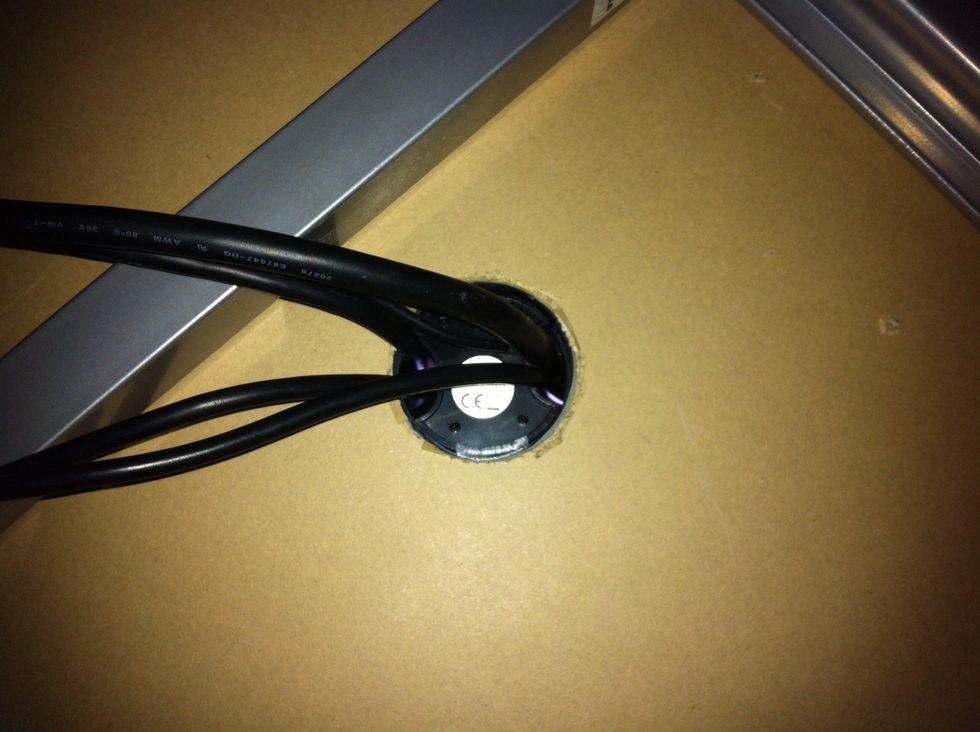 Before you drill: Measure carefully in case there is a metal frame beneath your desk (like the one on you see in the picture).