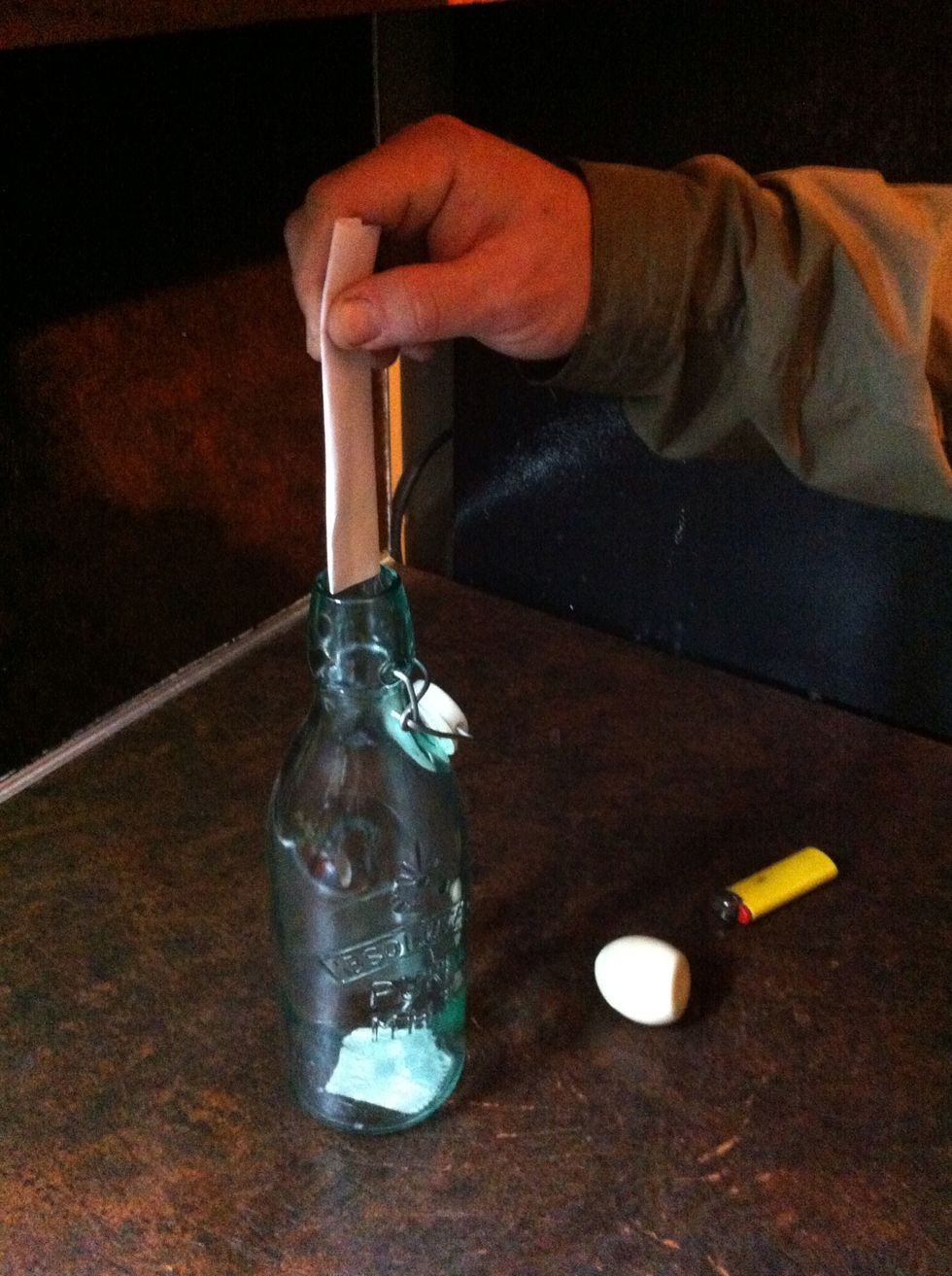 Before you get started!!!... Make sure the paper is folded small enough to fall into bottle easily. This is too big.
