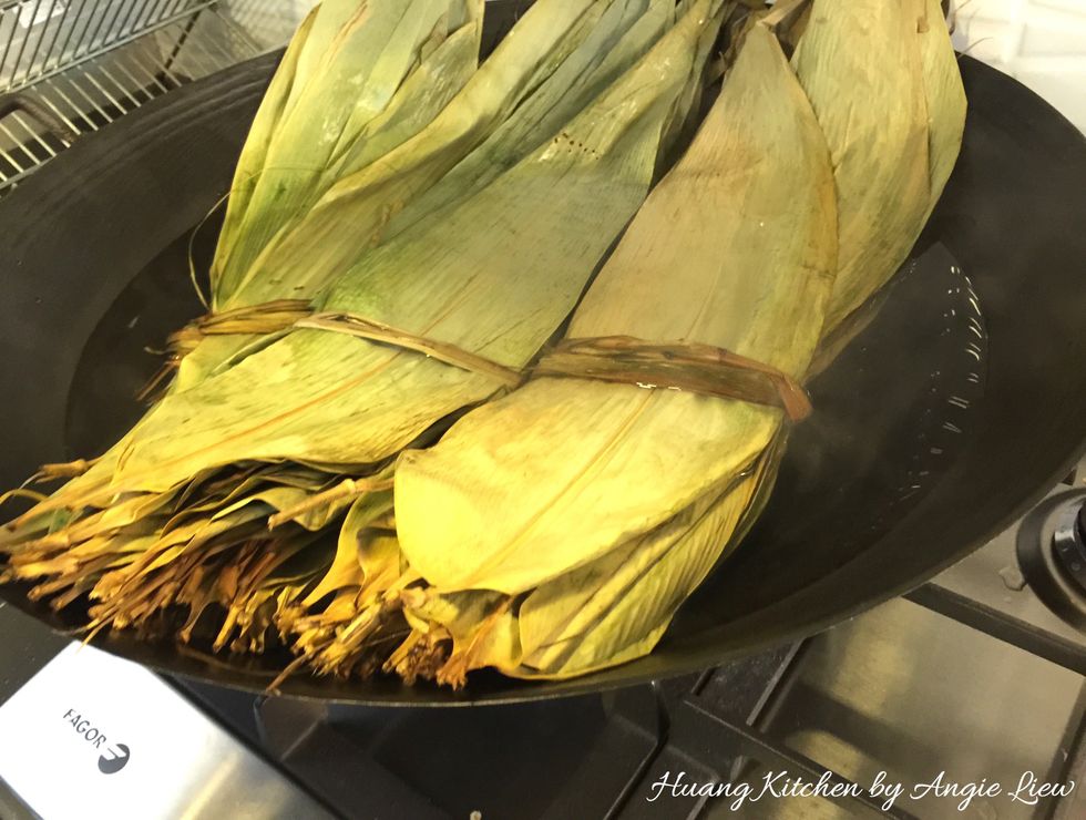 Before you make the rice dumplings, first boil, wash and soak bamboo leaves. This has to be done the night before.