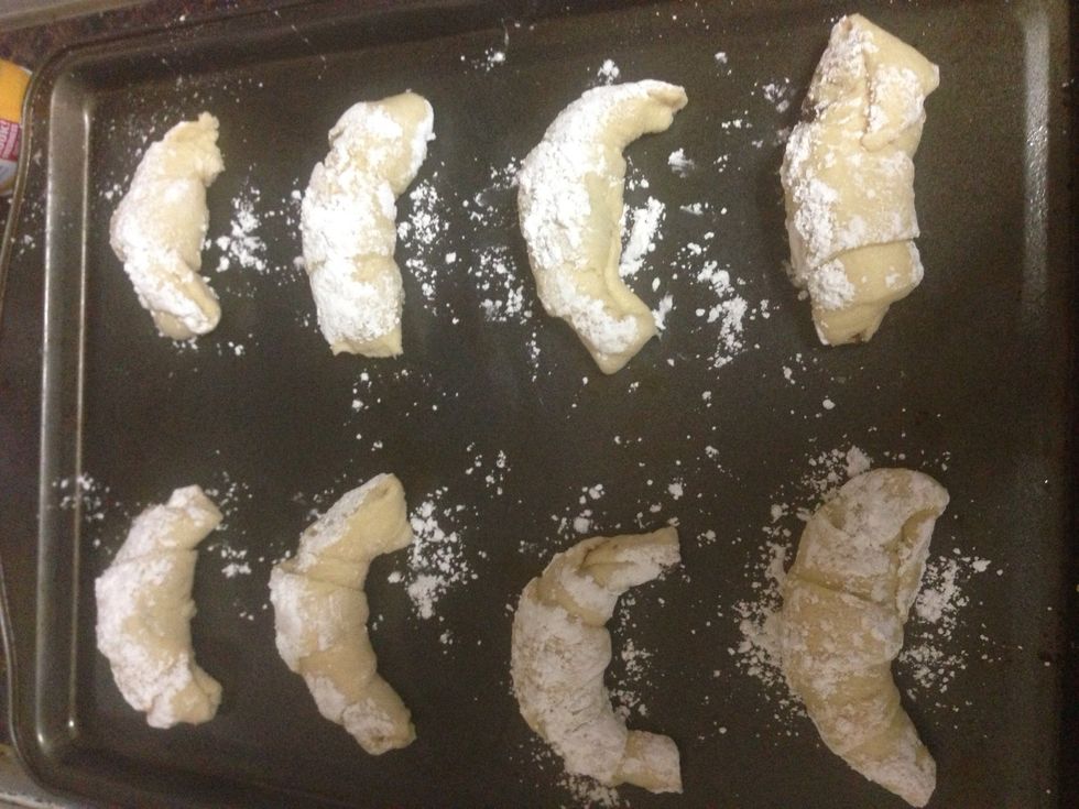 Before you place them on the cookie sheet spray some Pam on it, but not to much and place your crescent rolls make sure there's space between them. And place them on your oven for 10mins