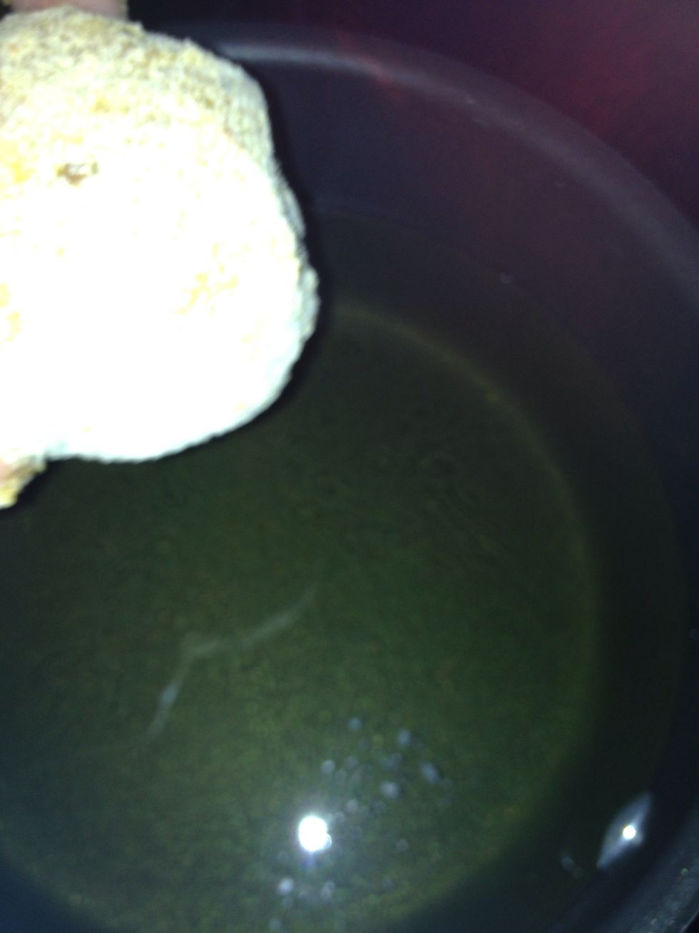 Before you put the balls in make sure your oil in high enough to fry the balls and hot enough If oil is not hot then everything will fall apart Make sure you use a medium size spoon to turn the ball