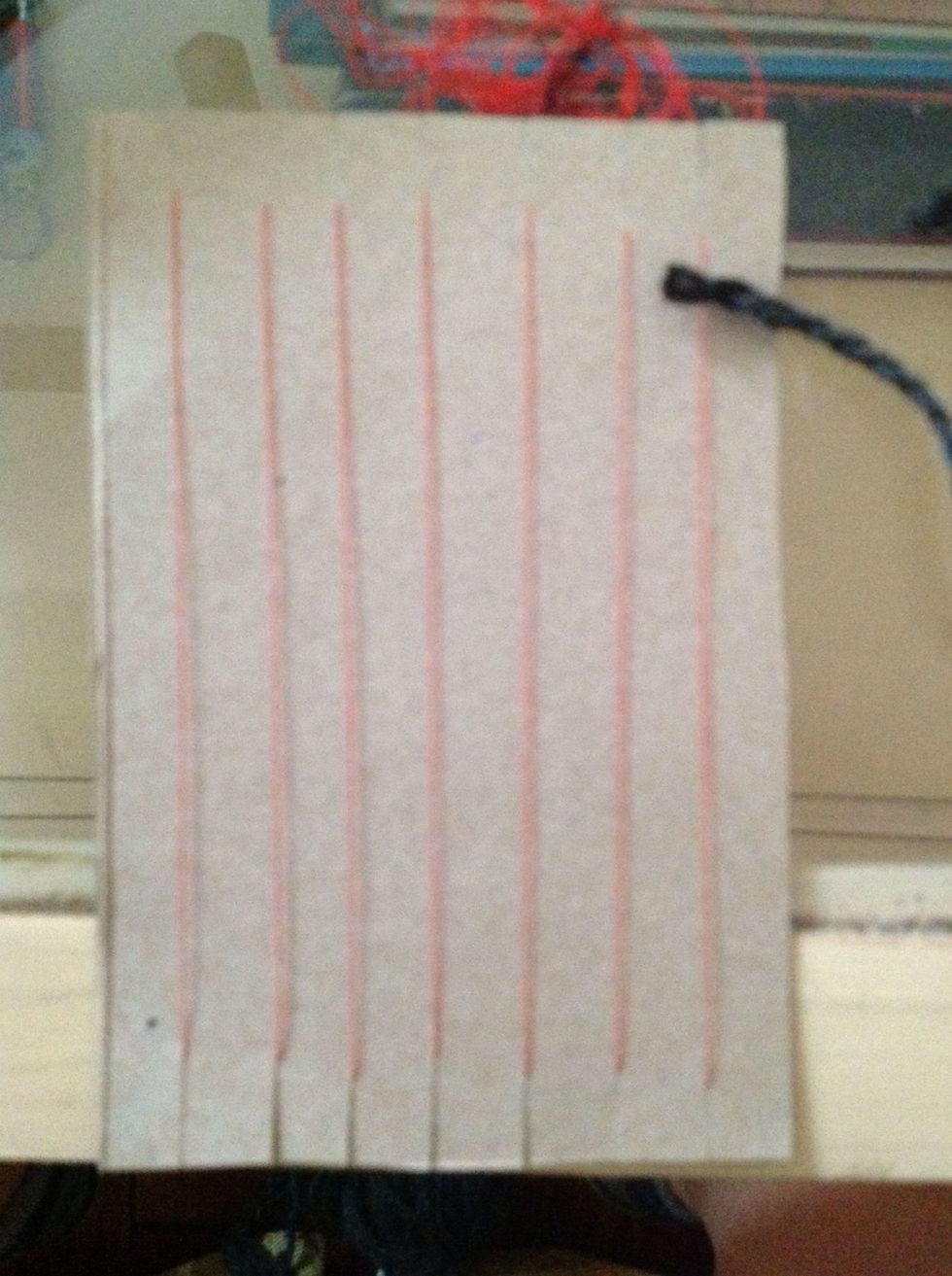 Begin a tabby weave by laying the yarn OVER your first warp string and UNDER your second string. Proceed following the over/ under pattern.