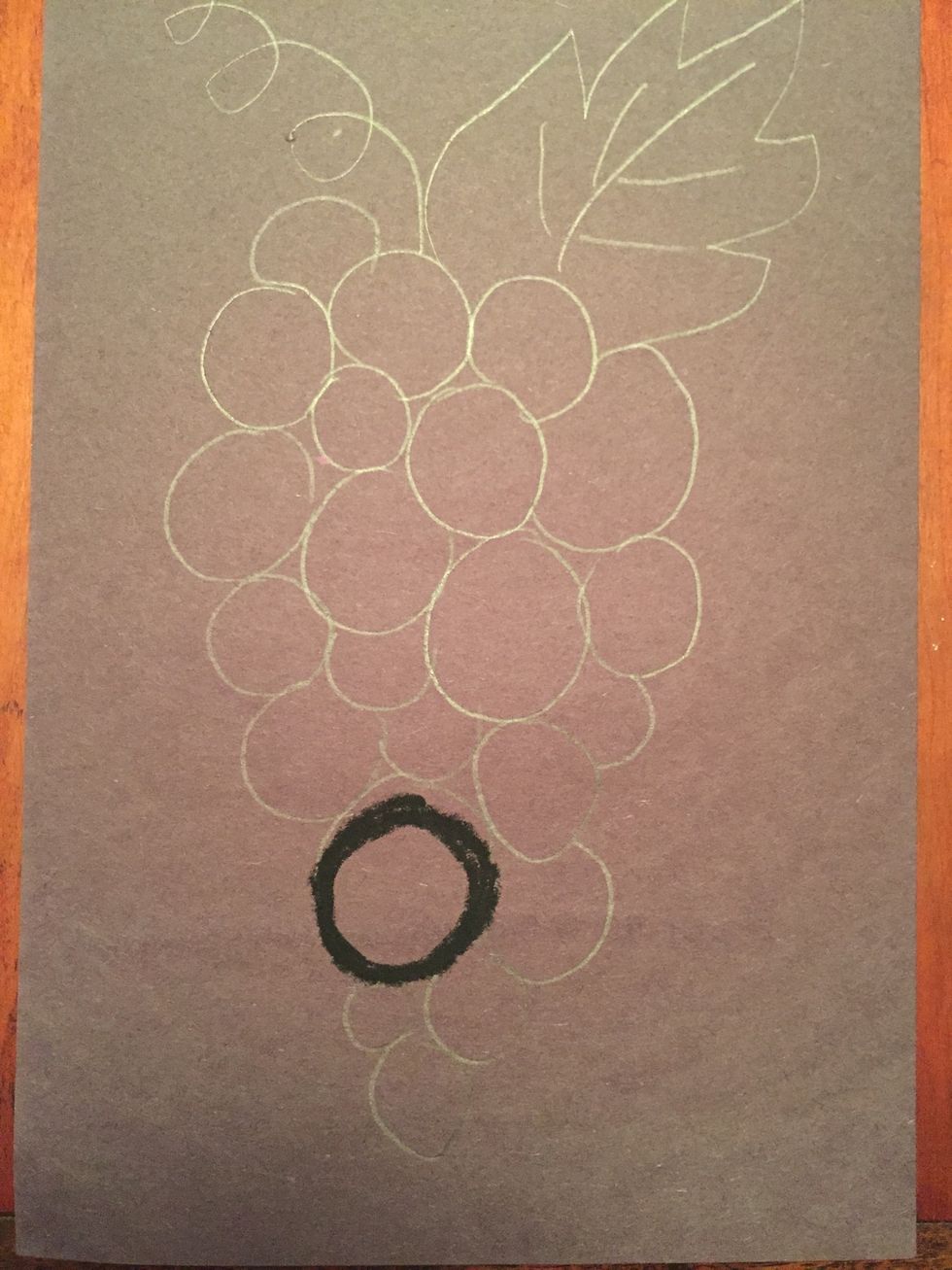 Begin adding value by outlining your grapes with black. Press hard.