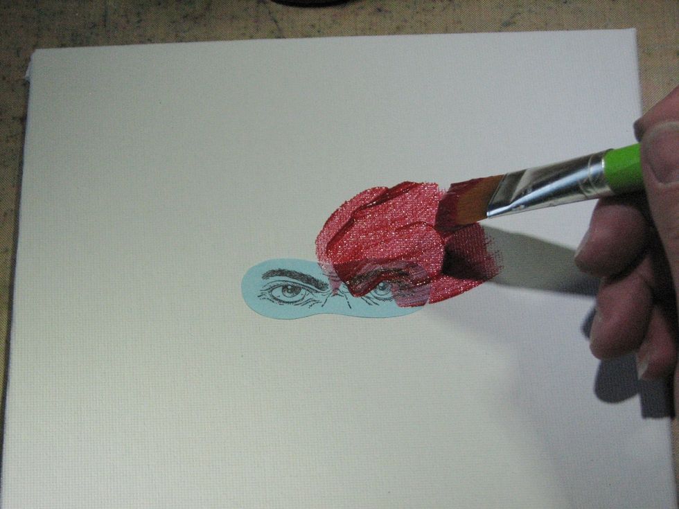Begin applying the first layer of paint.  Since this paint has a translucent quality I started from the eyes and worked towards the edges.