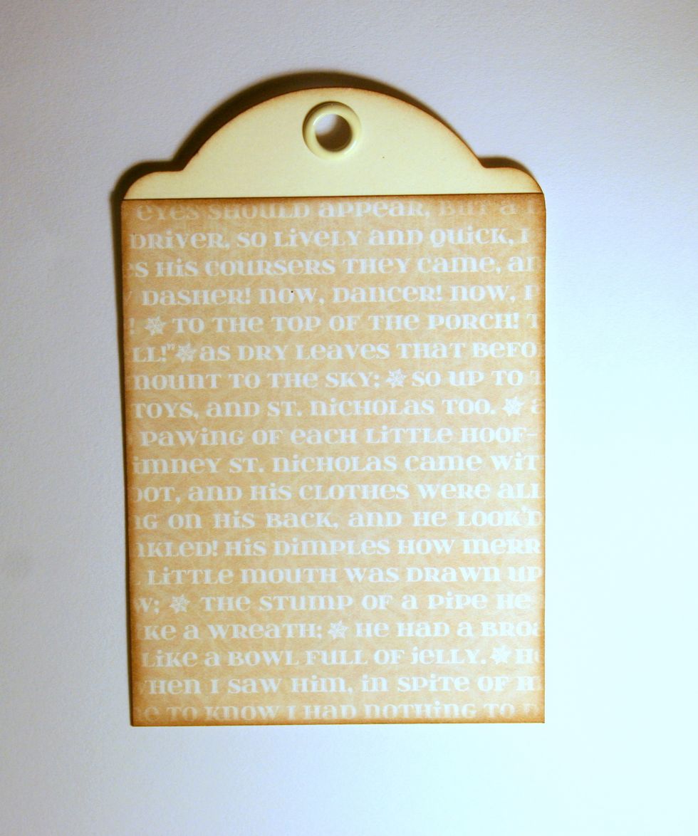 Begin by adding a layer of well inked patterned paper to a tag from the Ivory Tag Album.