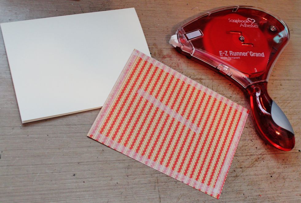 Begin by applying Scrapbook Adhesive to the back of pattern paper and placing it on a card base.