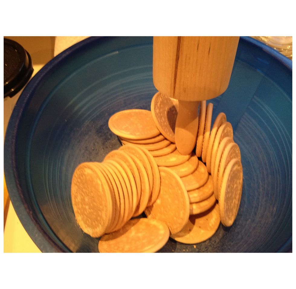 Begin by breaking up the biscuits to a fine crumb. I use an 'old-school' method of bashing them with a rolling pin handle (very labour intensive!)  but feel to use a food processor if you have one!