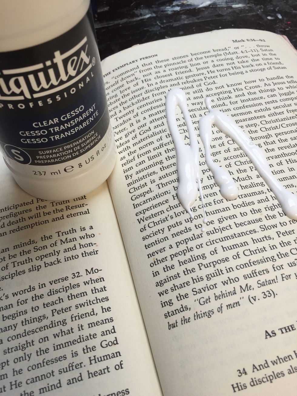 Begin by coating your pages with clear gesso