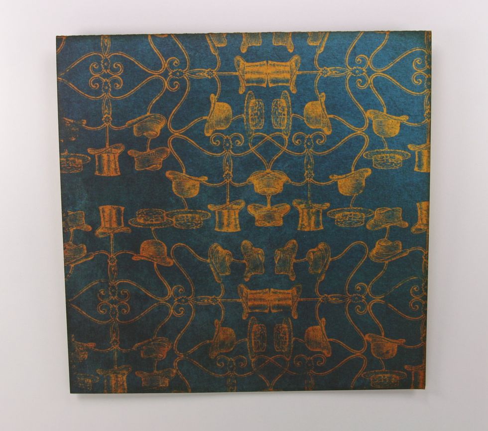 Begin by cutting a 6 x 12 inch panel to be the base of the card. Score at 6 inches to create a square. Ink all sides with Distress Ink.