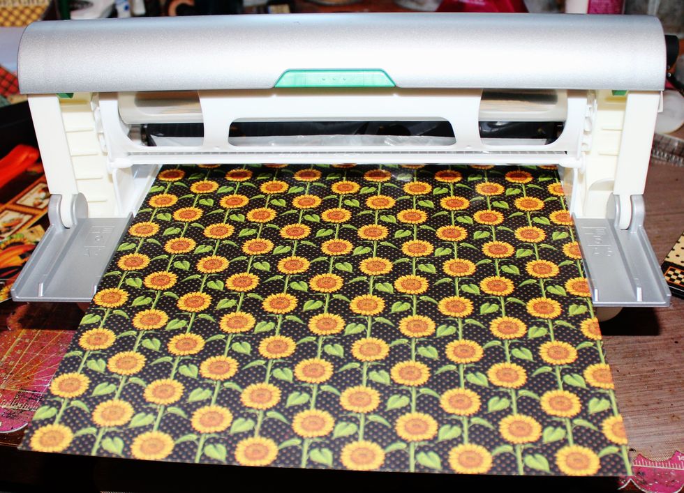 Begin by first adding adhesive to pattern paper. Cover box stand with prepared paper. Cut chipboard to fit stand; adhere paper to top of chipboard.