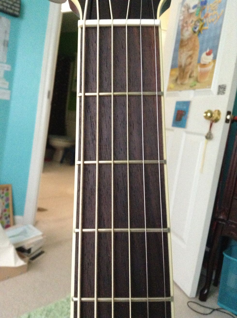 begin by looking at the first few frets on the fret board