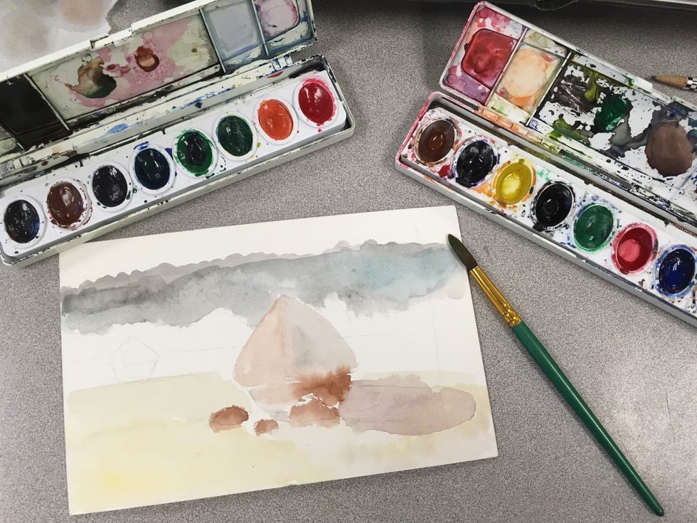 Begin by painting the general base colors you see with a larger brush and water colors