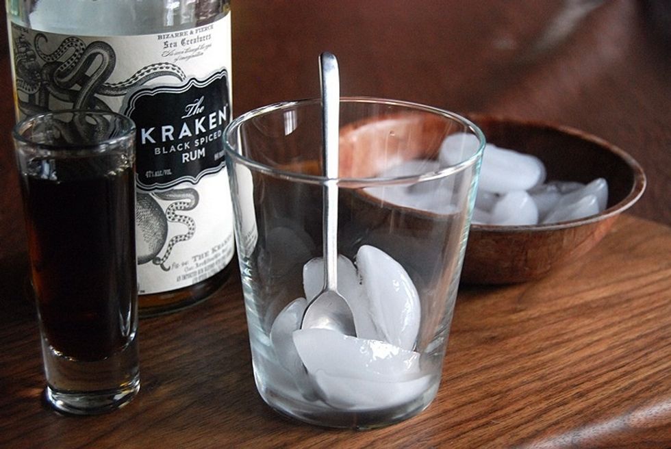 Begin by placing 3-5 ice cubes in your favorite cocktail glass...