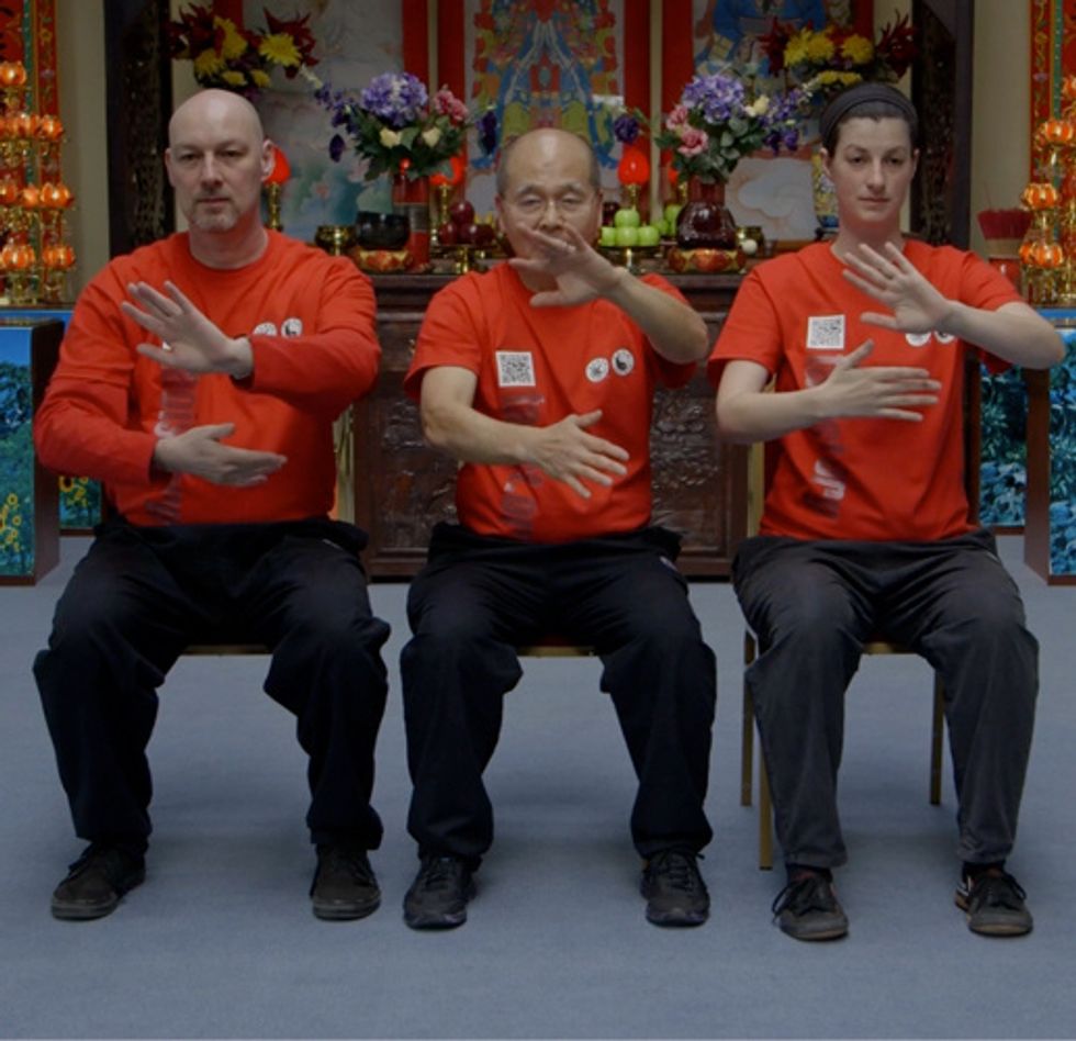 Begin by pushing your right arm away from you, palm facing out, and bring your left arm in (underneath the right). Do the same with the opposite arms to complete the cycle. Repeat 10 times or more.