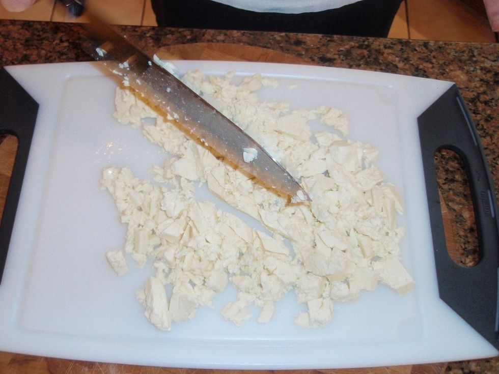 Begin by putting Mozzarella curd into a large mixing bowl, and cut the mozzarella curd into small pieces. Fresh Mozzarella Curd can be found at GoldenAgeCheese.com
