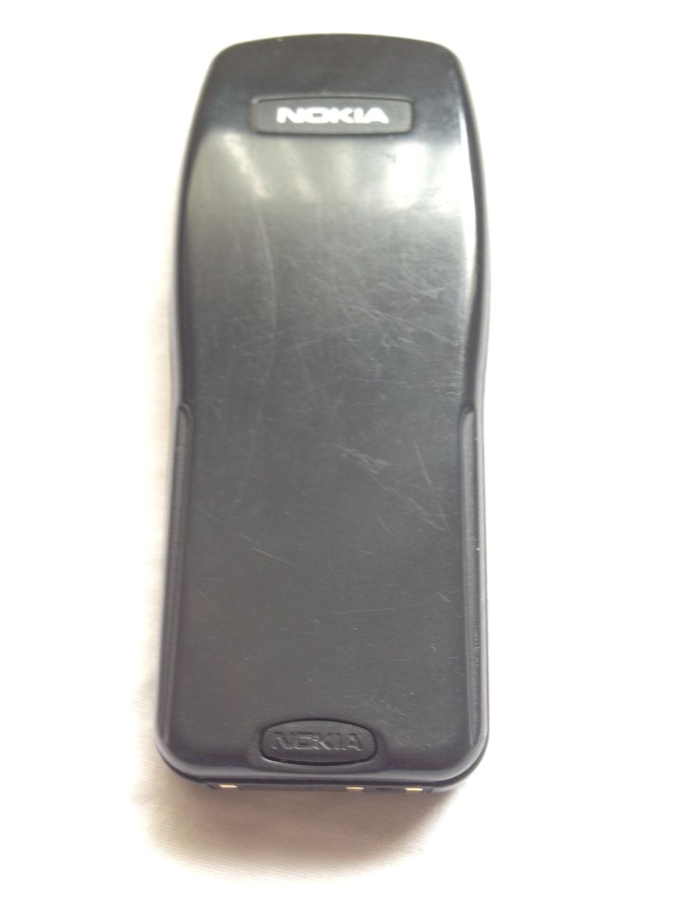 Begin by removing the back plate by pressing the button and sliding up.