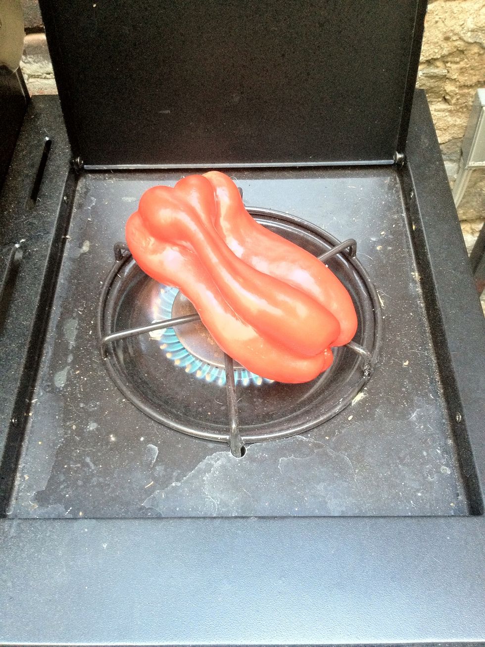 Begin by roasting your Red pepper on a open flame