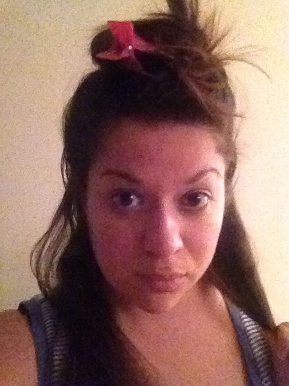 Begin by sectioning the hair into two sections. Top & Bottom.