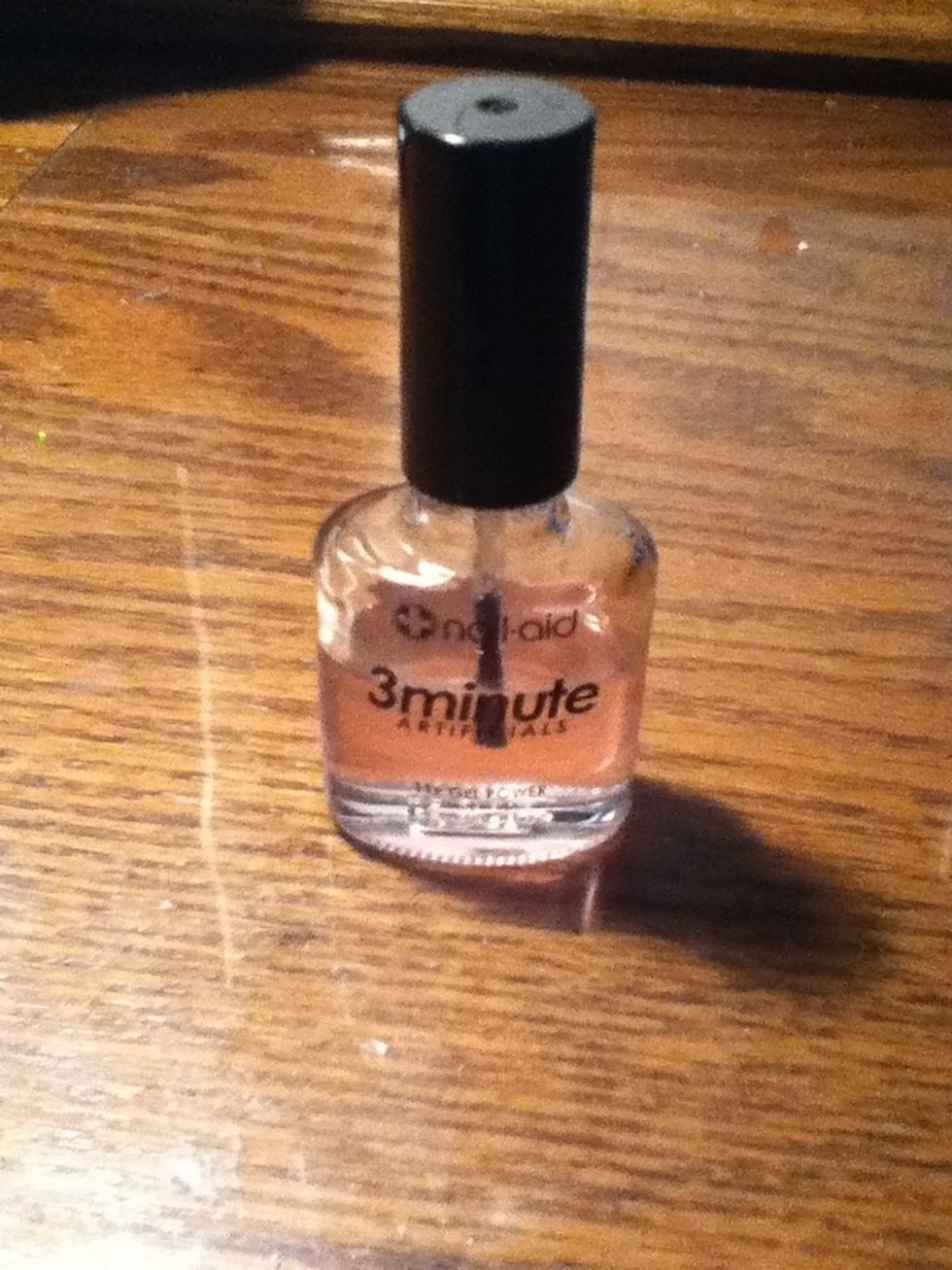 Begin by using a thin coat of clear nail polish on clean, bare nails. Let it dry completely.