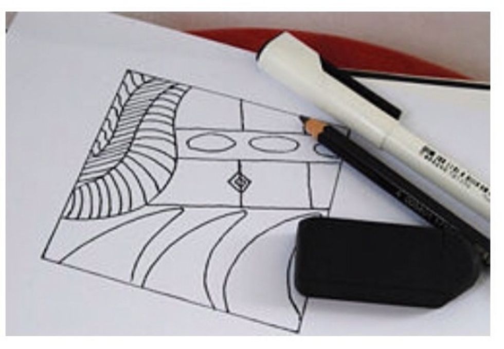 Begin filling each section with repetitive patterns. Shading can also be added.