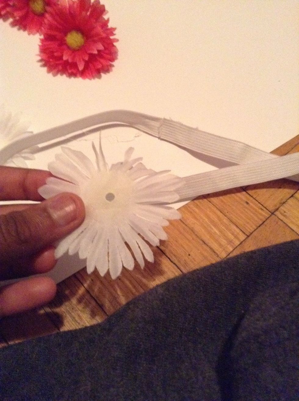 Begin gluing all the WHITE flowers evenly on the headband all the way around! BY SURE TO LAYER MOST OF THEM UPON EACH OTHER.