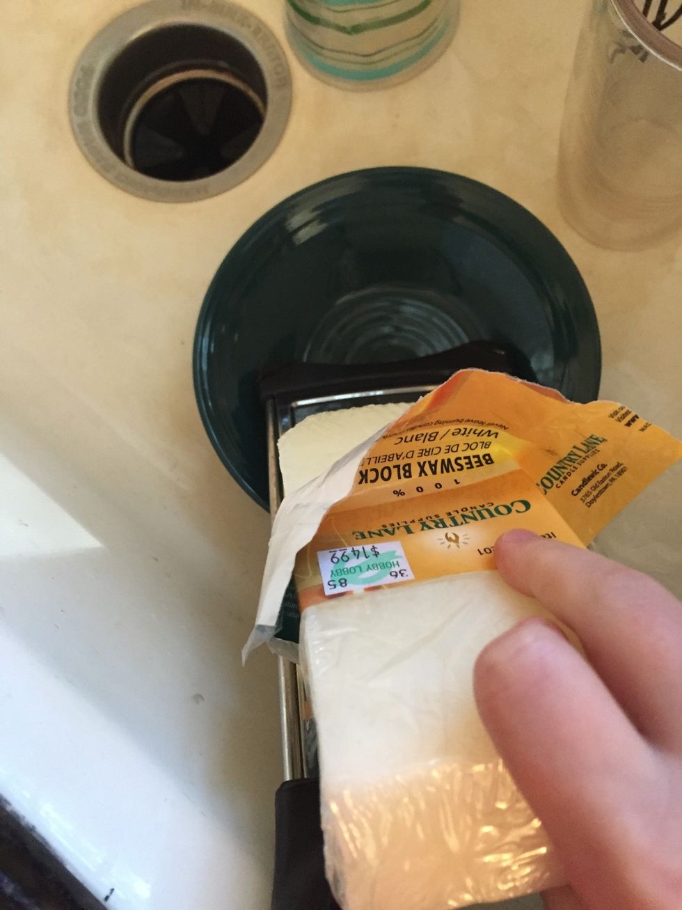 Begin grating beeswax and get one tablespoon and pour it into the mixture