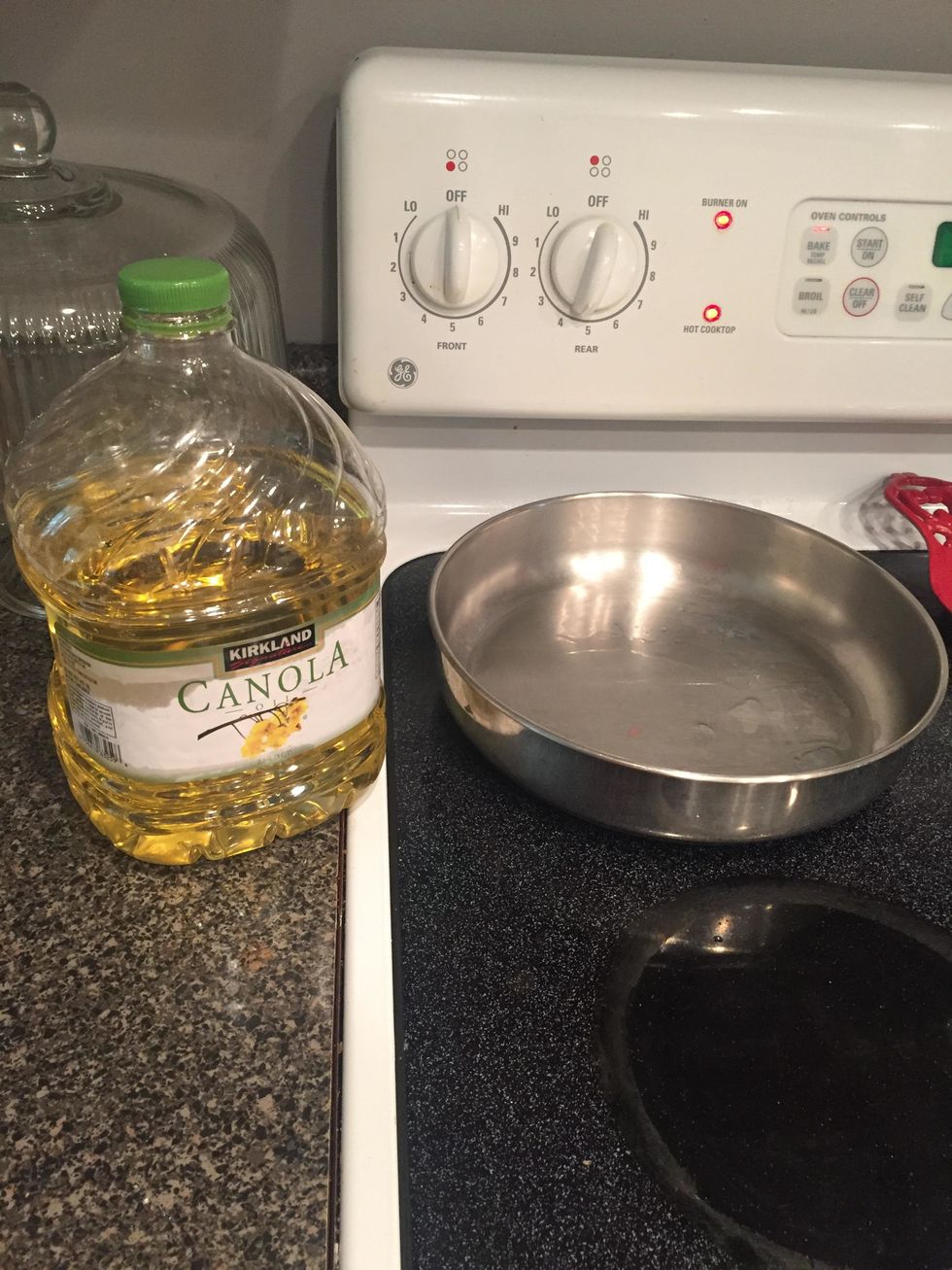 begin heating a medium sized pan at medium heat with canola oil in it