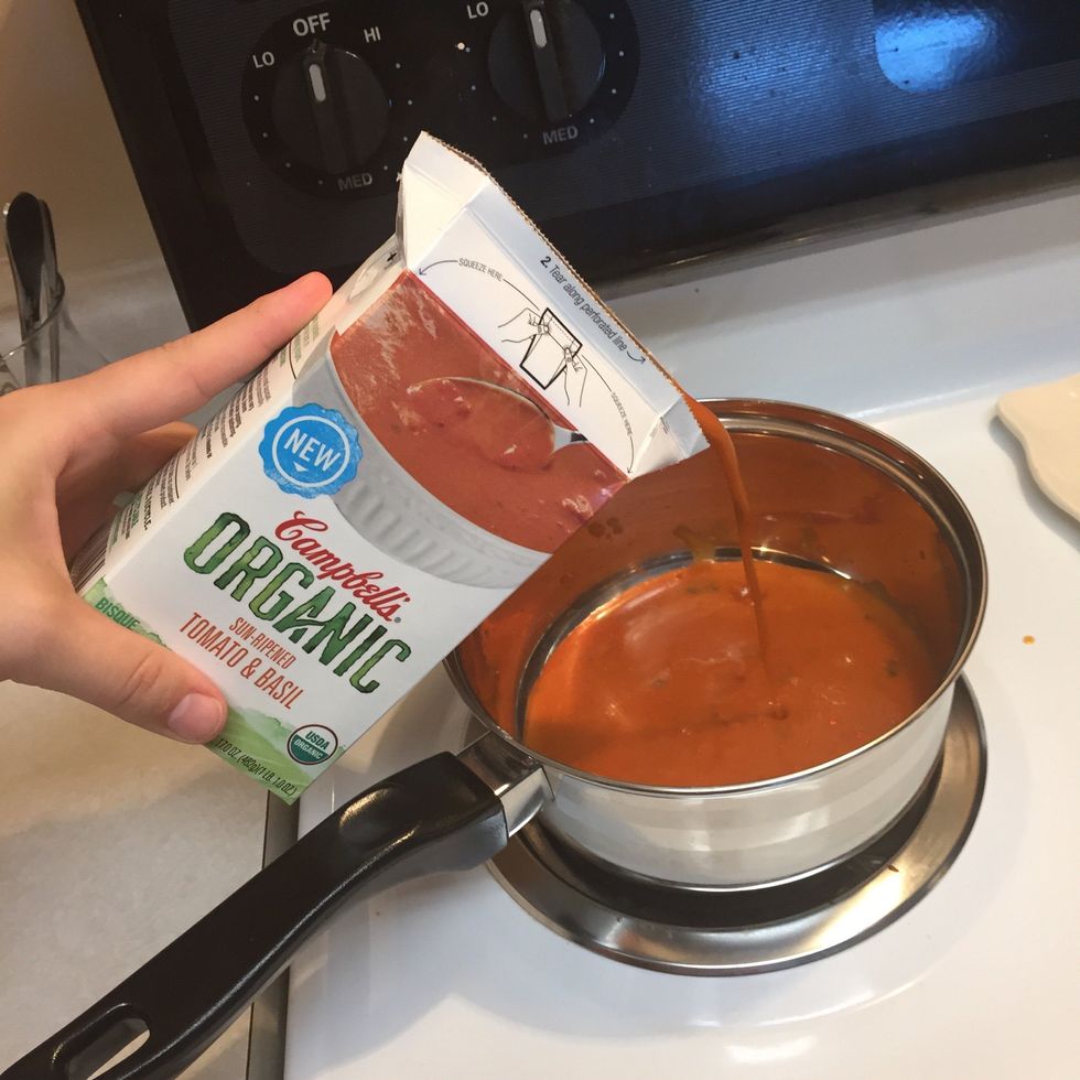 Begin heating your tomato soup on low