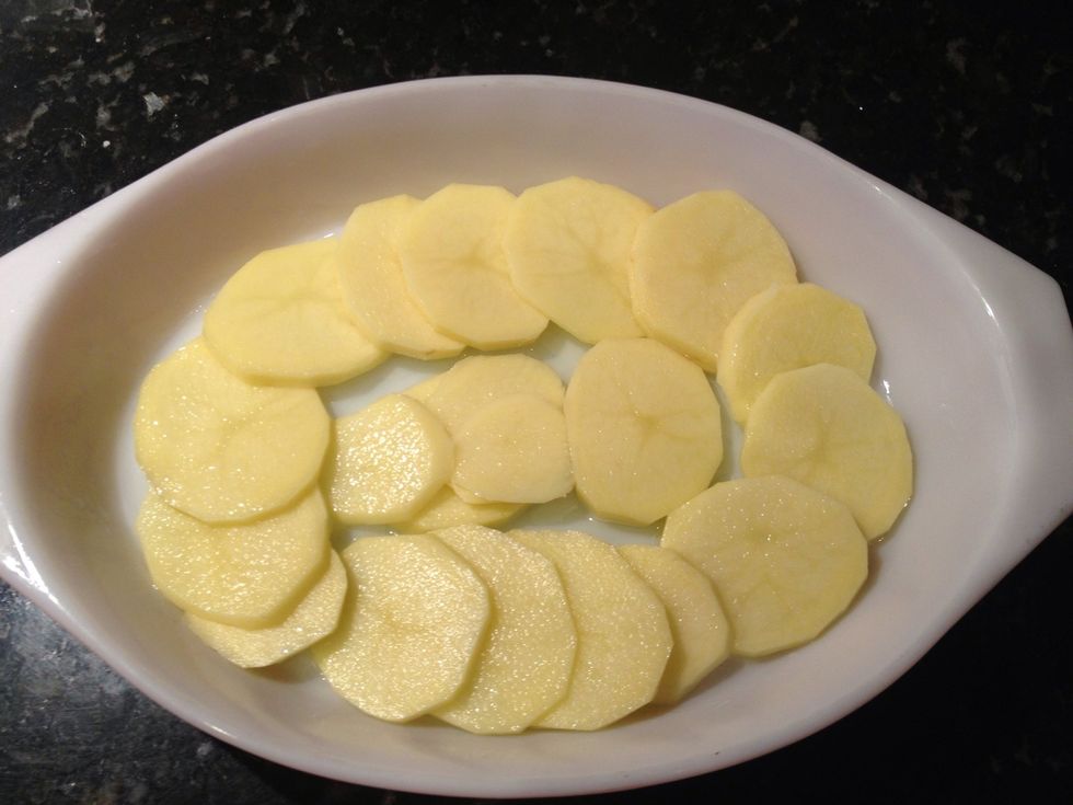 Begin layering potatoes into bottom of dish. You will repeat this 3 times alternating S&P and gruyere cheese.