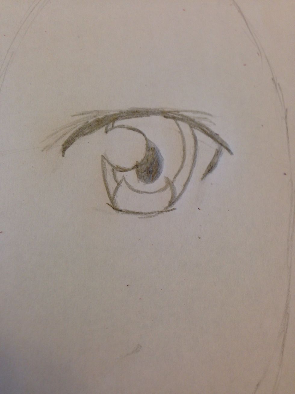 Begin making a crescent like shape in his eye