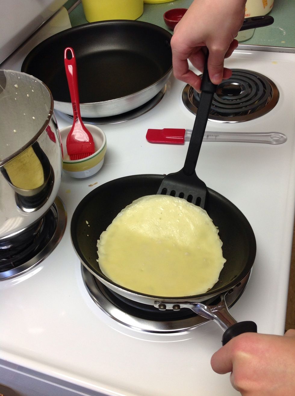 Begin making crepes on medium heat. Make sure to lightly grease pan.