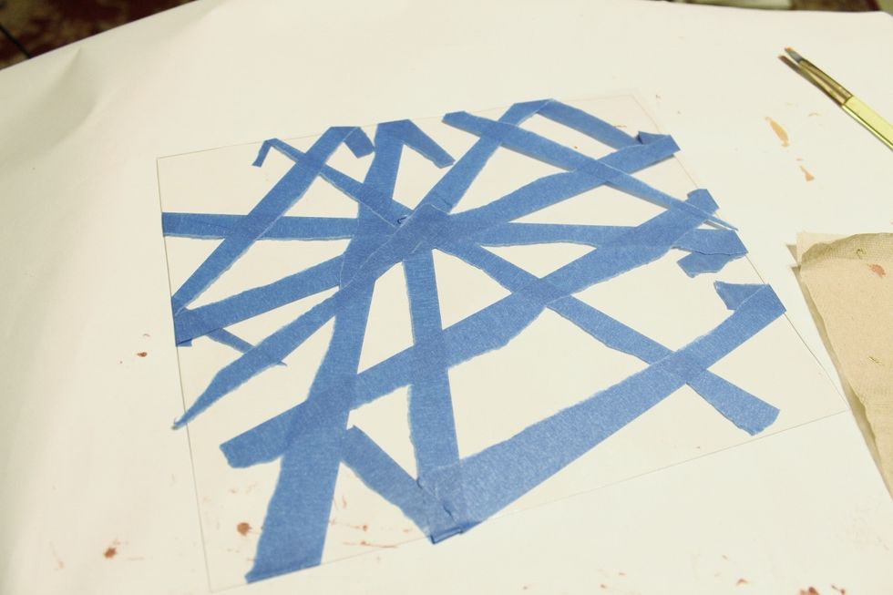 begin making second paper... clean Plate and tear and apply strips of blue painters tape to it...