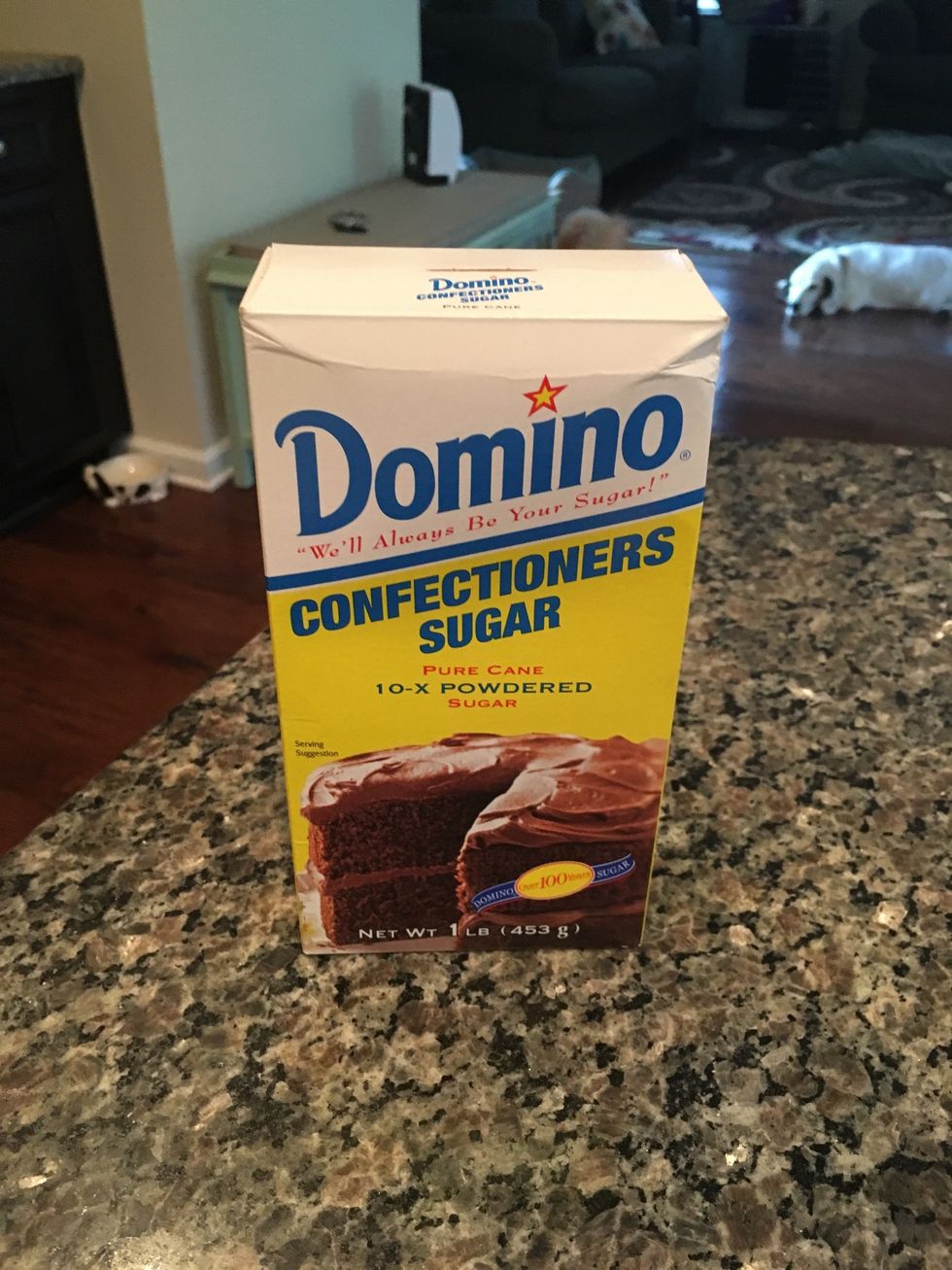 Begin making the frosting by measuring 16 ounces of powdered sugar. (16 ounces is typically the amount in one box.)