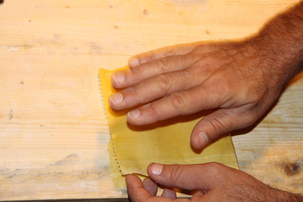 Begin on one end pressing firmly with fingers in the middle then work to the edges in order to assure there is no air left inside the pasta.