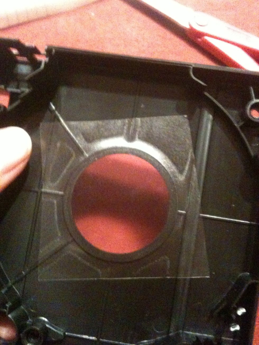 Begin on the inside: take a piece of self-sticking transparent paper and apply it to your cassette. Be sure to push down decently so that it won't get off.