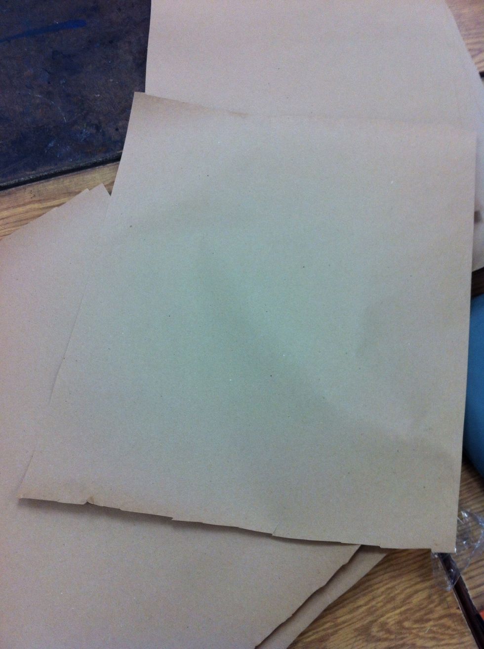 Begin on toned paper. We used brown craft paper.