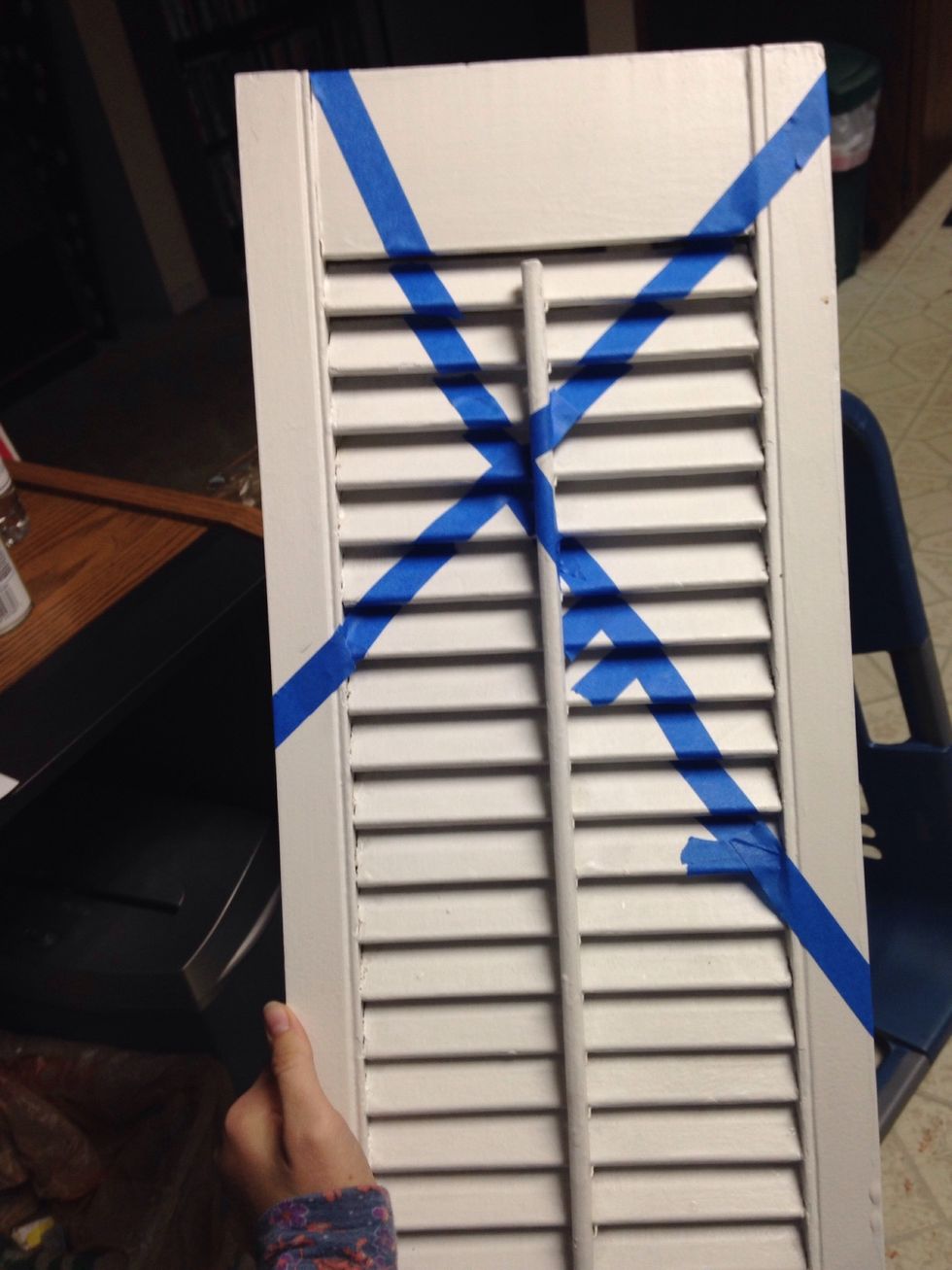 Begin putting masking tape on the shutter to mark off the different sections of color you want.