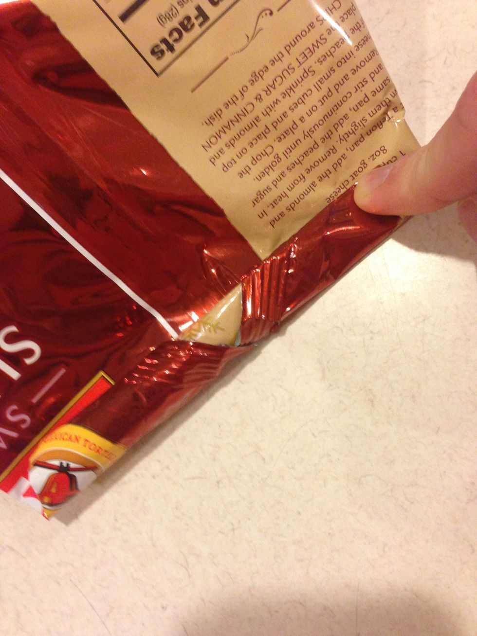 Begin rolling the bag somewhat tightly.
