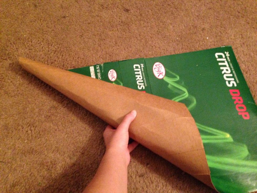 Begin rolling the cardboard at an angle from the top corner