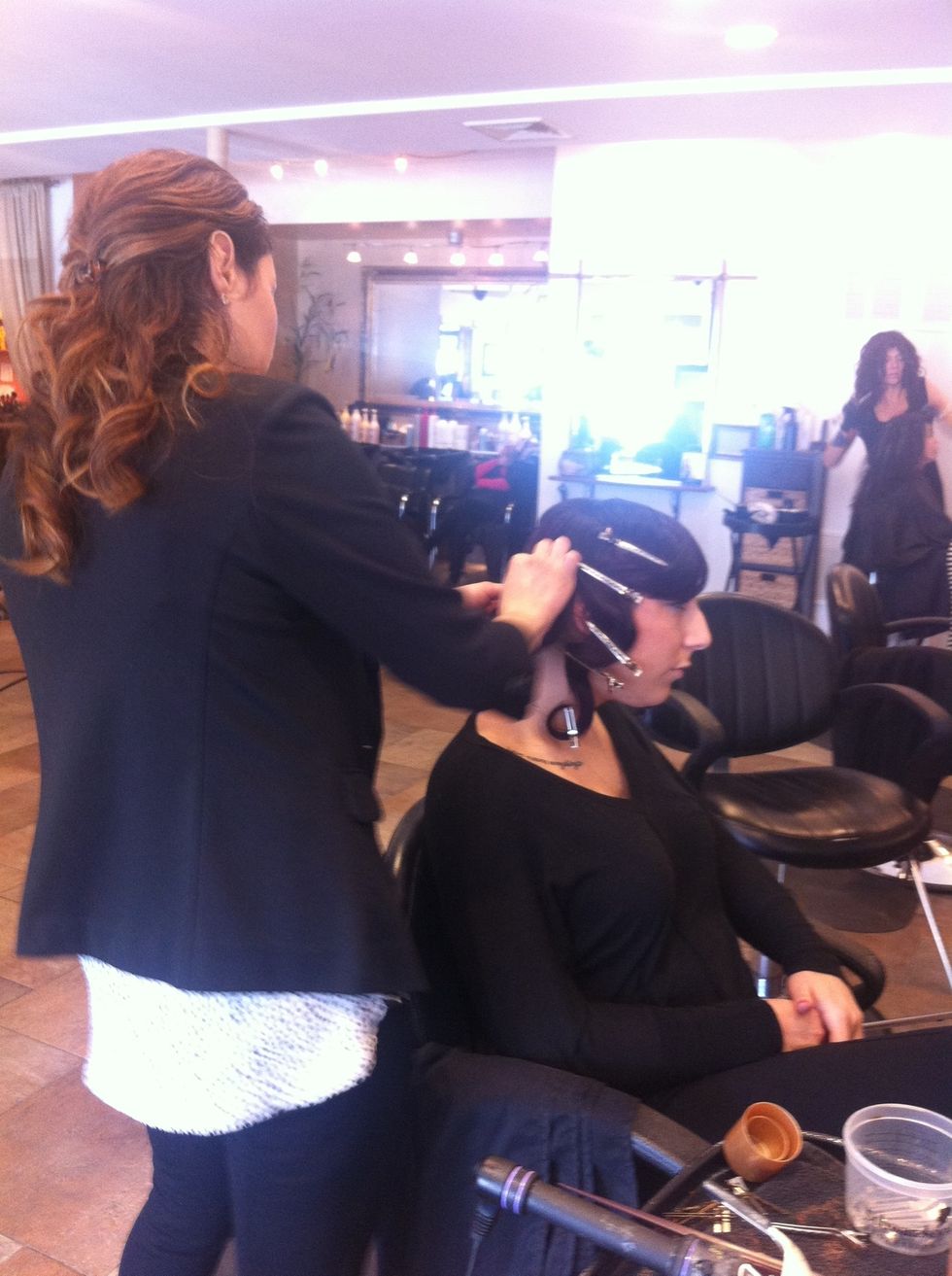 Begin shaping hair into bun..